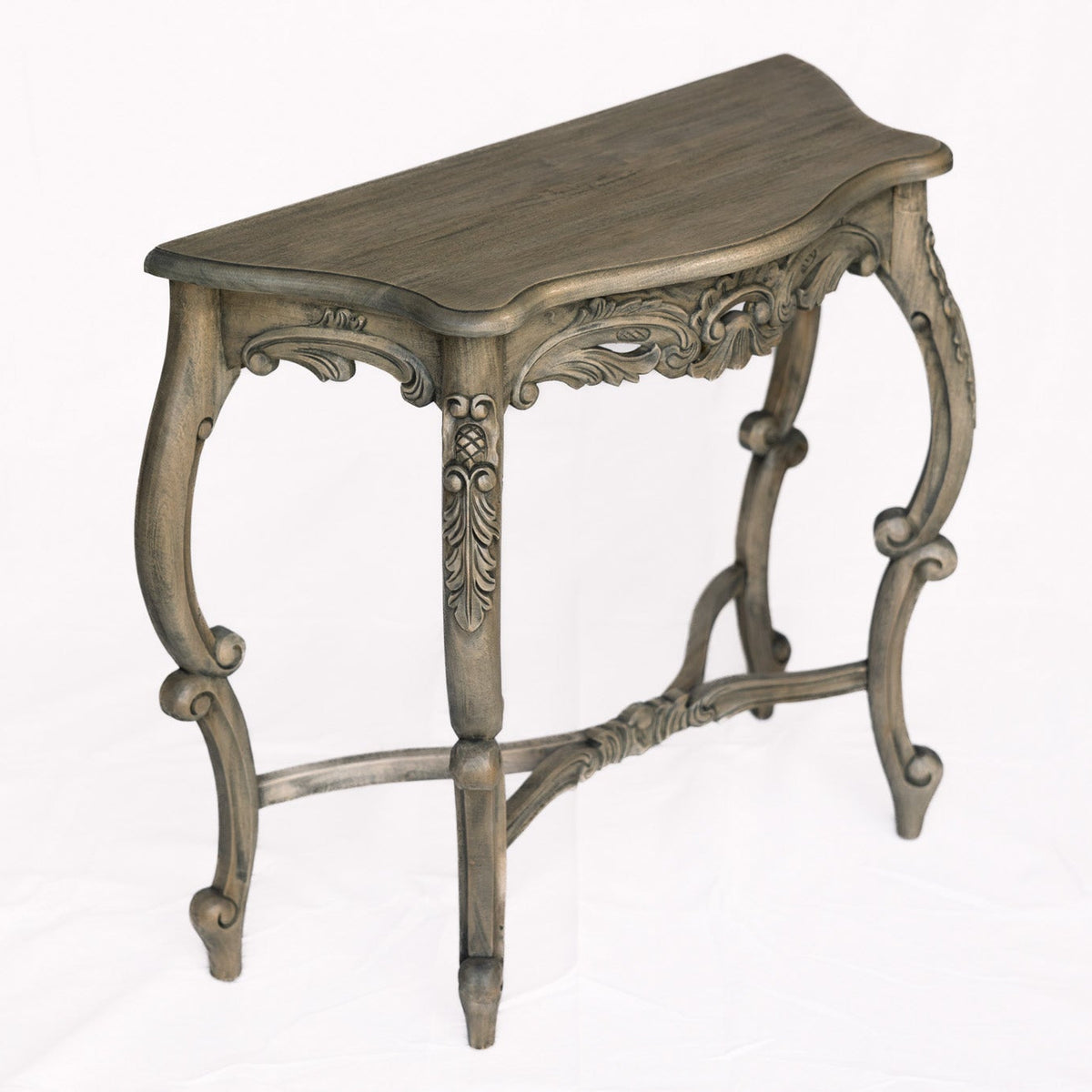 An ornate console table with a distressed gray-brown finish, featuring carved details and curved cabriole-style legs, shown against a plain white background.