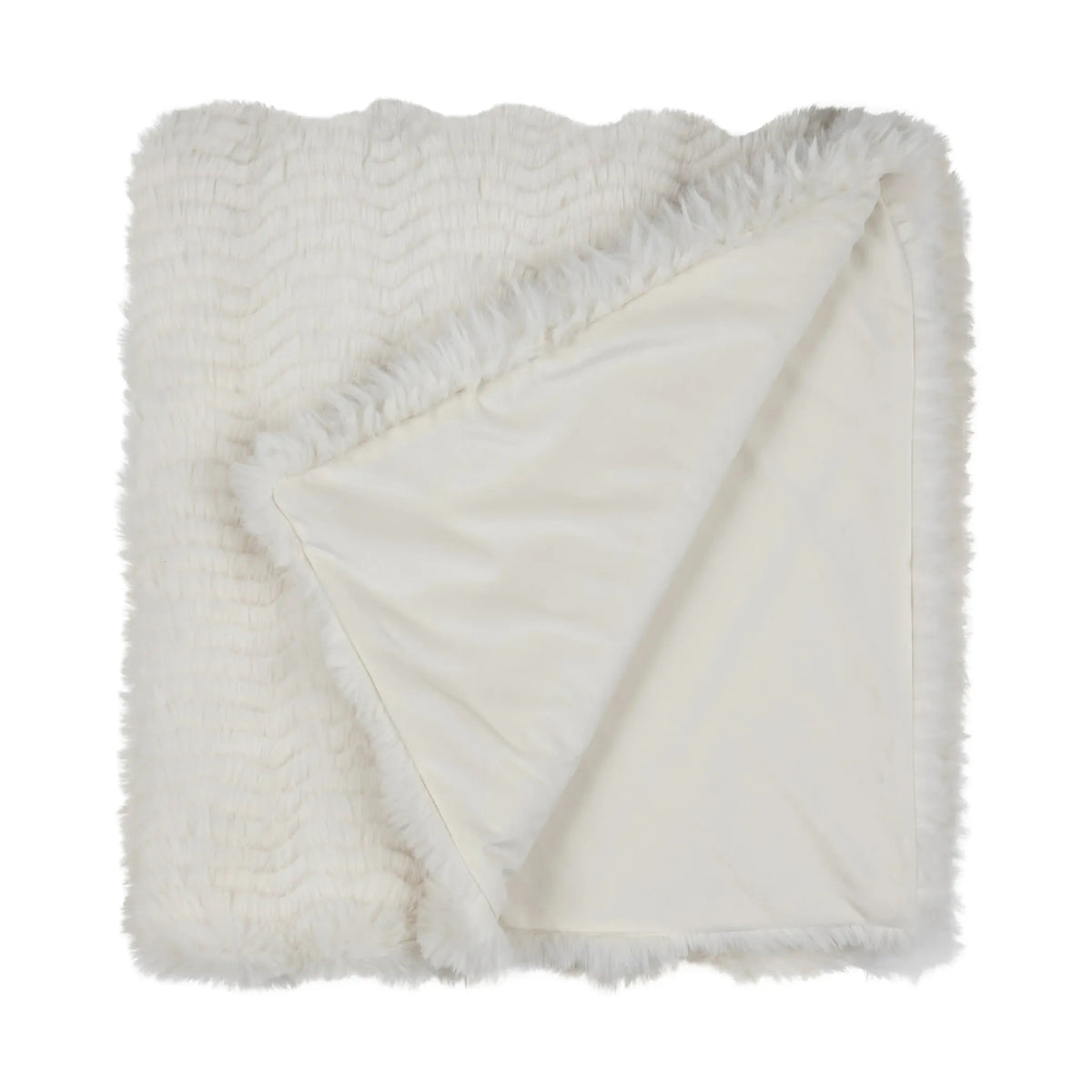 A folded white faux fur throw blanket with a textured wavy pattern on one side and a smooth satin-like reverse side, shown on a plain white background.