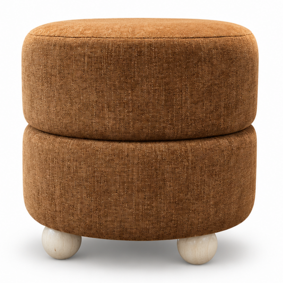 A round upholstered ottoman with two stacked cushioned tiers in a warm rust-brown fabric, shown in a styled living room setting on the left and isolated on a white background on the right.