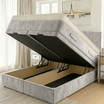 Gray upholstered bed with storage compartment in a bedroom setting