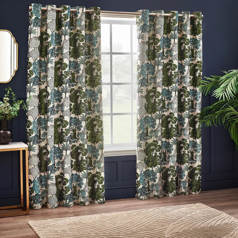 WOODLANDS ROOM DARKENING EYELET CURTAINS IN GREEN by Wylder